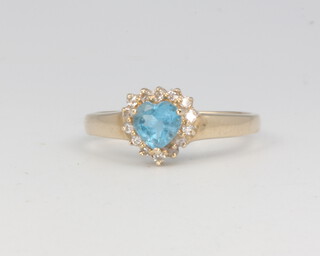 A 14ct yellow gold heart shaped blue topaz and diamond cluster ring size K 1/2, 2.3 grams