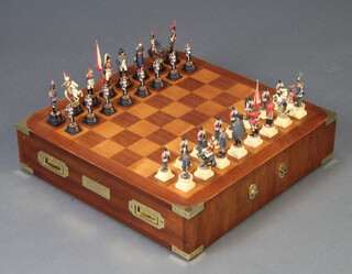 Waterloo Commemorative, a limited edition Waterloo chess set, no.135 of 250, complete with certificate and contained in an inlaid mahogany board fitted 2 drawers 