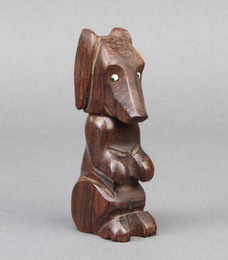 A 1920's carved wooden lighter in the form of a dog 10cm x 2cm x 4cm 