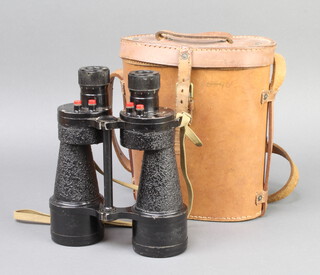 A pair of military issue Bino.prims no.5 Mk 5 x X binoculars marked O.S.419 N.A. reg. no. 84618 Graticules half apart and quarter half and one percent high, complete with leather carrying case 