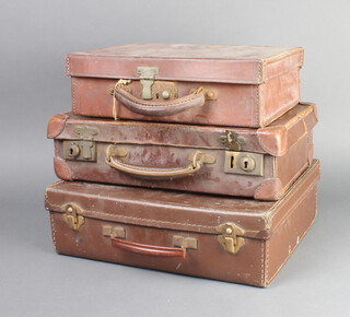 A brown leather attache case with chrome mounts 9cm x 30cm x 21cm (some rust to mounts), 1 other 9cm x 35cm x 22cm (some scuffing) and a pressed fibre ditto 9cm x 33cm x 28cm 