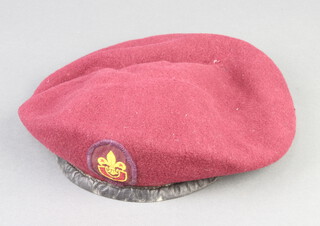 A World War Two Parachute Regiment red beret by Kangol Wear Ltd. with broad arrow and dated 1942, with Senior Scout badge to the front, label to the interior Skife-d'ingerthorpe (late Captain Royal Artillery Airborne Division 
