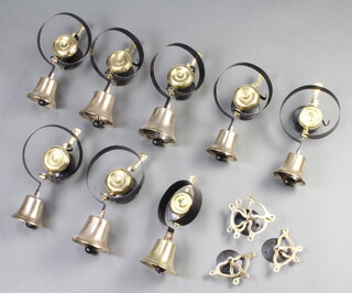 A set of 8 Victorian graduated brass servants bells, 5 marked 8, 2 marked 10 and 1 marked 12  