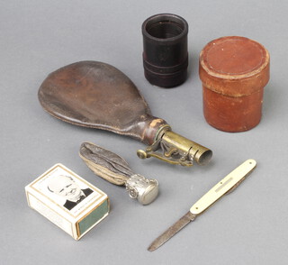A 19th Century leather and brass shot flask, a Winston Churchill match slip, folding pocket knife and 2 other items 