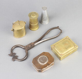 An advertising paperweight in the form of a churn for Churnbrand Feeding Stuffs marked BGC 8cm h x 4cm, brass inkwell in the form of a milk carrier complete with ceramic inkwell 5cm x 5cm x 4cm, a Ges Gesch brass stamp box with hinged lid 2cm x 8cm x 6cm, a silver plated trinket box with hinged lid set a George III coin 2cm x 7cm x 5cm, brass turned paperweight in the form of a milk churn 7cm x 4cm and a pair of polished steel sugar cutters 