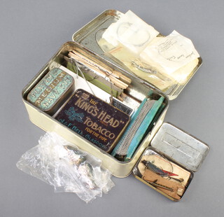 A white enamelled tin with hinged lid containing a large collection of vintage gimp fishing trace lines, carded silk lines, lures etc, etc, 