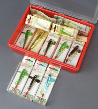 A plastic lure box containing a collection of 12 Allcocks Devon minnow fishing lures and an Allcocks fly spool  