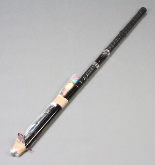 A 1960's Shakespeare telescopic beach casting fishing rod together with a similar spinning rod (2) 