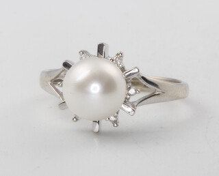 A 10ct white gold cultured pearl and diamond ring, 2.1 grams, size J 
