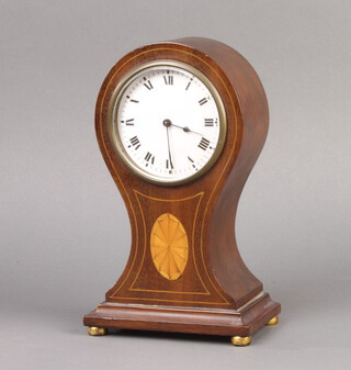 An Edwardian French bedroom timepiece with enamelled dial and Roman numerals contained in an inlaid mahogany balloon case 