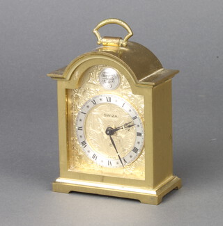Swiza, a Swiss 8 day alarm clock contained in a Queen Anne style gilt metal case, the dial with silver chapter ring, raised on bracket feet 9cm h x 3cm w x 7cm d 
