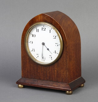 A French 8 day bedroom timepiece with enamelled dial and Arabic numerals contained in a mahogany lancet shaped case  