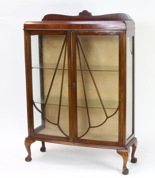 A 1930's Art Deco mahogany display cabinet with raised back, enclosed by astragal glazed panelled doors, raised on cabriole supports 131cm h x 88cm w x 31cm d (broken section of glass to the right hand side) 