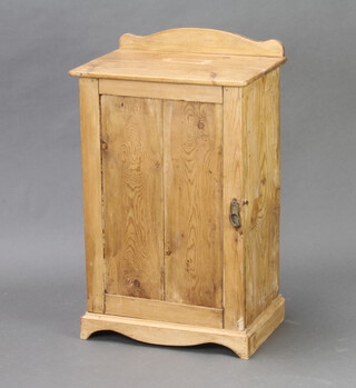A Victorian pine pot cupboard with raised back enclosed by a panelled door raised on bracket feet 77cm h x 45cm d x 31cm d (split to top and door and signs of old but treated worm to the sides) 