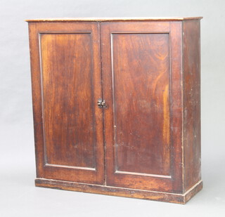 A 19th Century mahogany cabinet with shelved interior enclosed by a pair of panelled doors 102cm h x 100cm w x 34cm d  