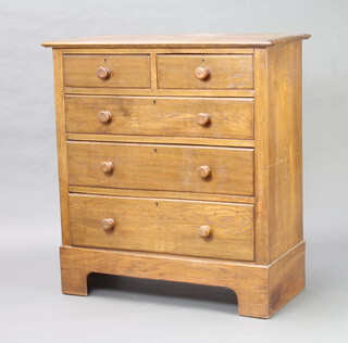 An Edwardian oak chest of 2 short and 3 long drawers raised on bracket feet 98cm h x 99cm w x 45cm d (water mark to the top) 