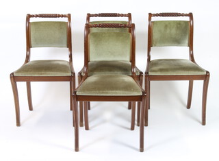 A set of 4 Regency style rope back dining chairs with upholstered drop in seats, raised on sabre supports 