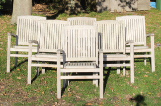 Corido, a set of 6 well weathered teak slatted garden open arm chairs 