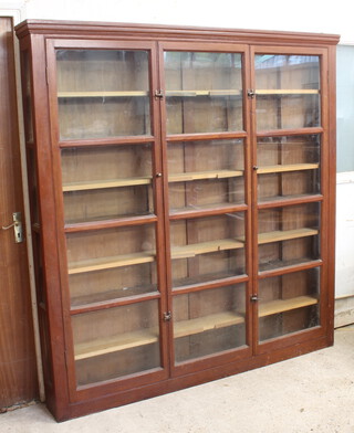 A 19th Century mahogany display cabinet with moulded cornice, the shelved interior enclosed by glazed panelled doors 193cm h x 186cm w x 22cm d (1 glass panel to the side is damaged) 