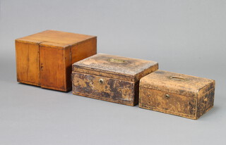 A Victorian leather bound D shaped jewellery box 10cm h x 25cm w x 19cm d and 1 other (leather on both is perishing in places), together with a Victorian mahogany table top cabinet enclosed by a pair of panelled doors 21cm h x 27cm w x 26cm d  