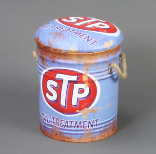 A cylindrical stool/storage box with padded lid in the form of a STP oil can 36cm h x 32cm diam. 
