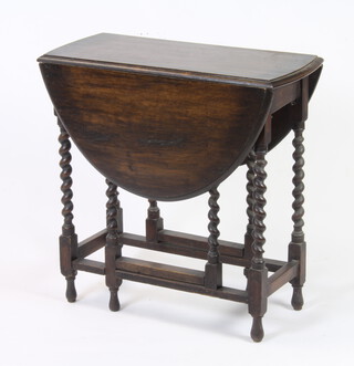An oak oval gateleg tea table on spiral turned supports 73cm h x 73cm w x 32cm when closed (signs of old but treated worm)  