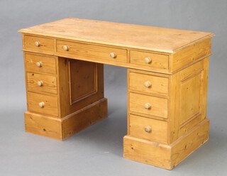 A pine kneehole desk fitted 8 short drawers with tore handles 74cm h x 120cm w x 58cm d (some ring marks to the top) 
