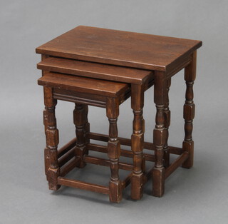 A nest of 3 rectangular oak interfitting coffee tables on turned and block supports 47cm h x 48cm w x 33cm d 