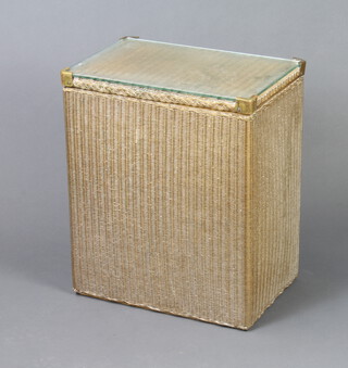 A rectangular gold painted Lloyd Loom linen basket with hinged lid and plate glass top, the base dated 15th May 1950 55cm h x 46cm w x 32cm d 