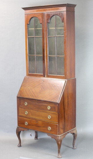 A 1930's Georgian style mahogany bureau bookcase with moulded cornice, fitted shelves enclosed by astragal glazed panelled doors above a fall front and 3 drawers 209cm h x 76cm w x 46cm w 