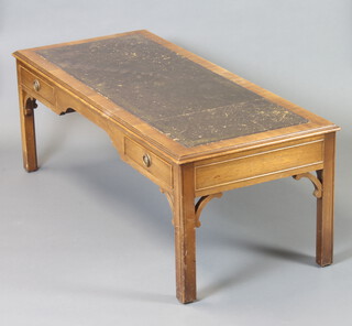 A Georgian style rectangular mahogany coffee table with inlaid green leather top, fitted 2 frieze drawers and raised on square supports 43cm h x 124cm w x 53cm d (some marks to the leather)  
