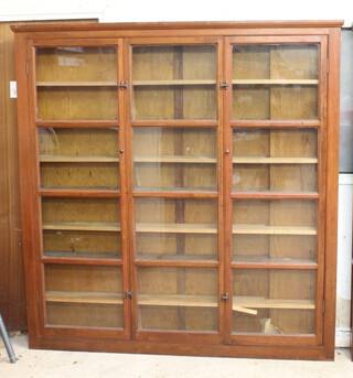 A 19th Century mahogany cabinet with moulded cornice, the shelved interior enclosed by glazed panelled doors 194cm h x 186cm w x 22cm d 
