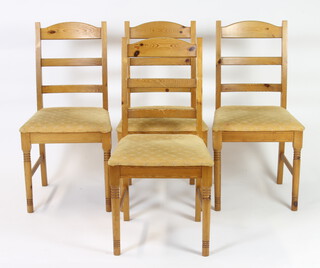 A set of 4 pine ladderback dining chairs 