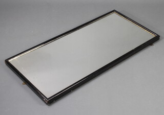 A rectangular plate mirror contained in an ebonised frame 123cm x 56cm 