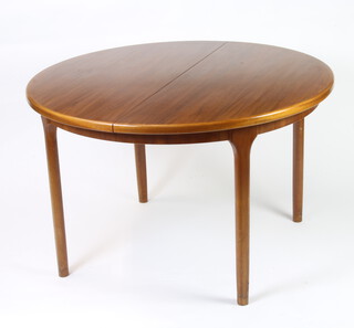 Nathan, a mid Century teak extending dining table raised on turned supports 76cm h x 122cm l 
