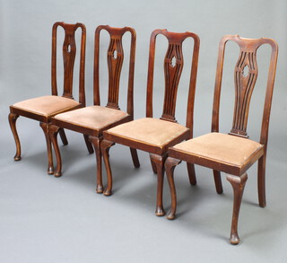 A set of 4 1930's pierced vase shaped slat back dining chairs with upholstered drop in seats on cabriole supports 