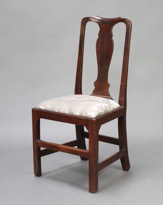 An 18th Century oak slat back dining chair with upholstered drop in seat