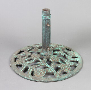 A circular pierced cast iron parasol base 46cm h x 59cm diam. 