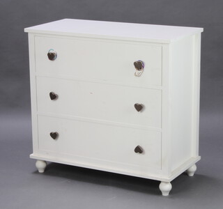 A white laminate chest of 3 long drawers with heart shaped handles 87cm x 91cm x 44cm and  wooden laminate finished chest of 5 long drawers with turned handles 104cm h x 76cm w x 39cm d 