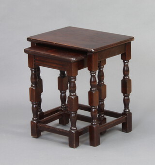 Two oak interfitting coffee tables 