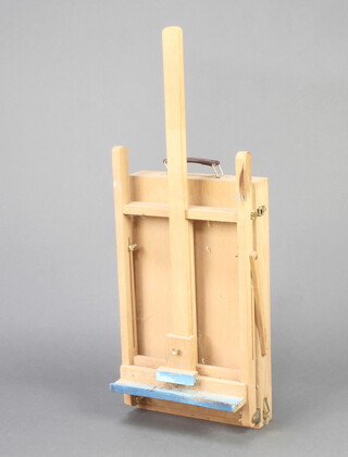 An artists beech framed easel incorporating a paint box 82cm h x 10cm w x 30cm d 
