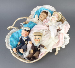 Two Norah Wellings felt figures of sailors 20cm together with 3 dolls contained in a Moses basket