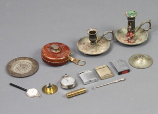 A pair of circular gilt metal chambersticks 10cm x 9cm, a Benares brass dish 10cm, 2 lighters, etc 

