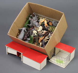 A collection of Britains plastic zoo animals and cages