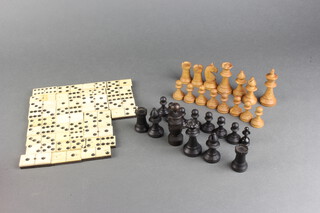 A part chess set (missing white knight and 2 black knights) together with a 32 piece ebony and bone domino set 