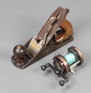 A Stanley Bailey No.4 smoothing plane together with a Shakespeare Neptune Gear Ratio 5.3.1 fishing reel 