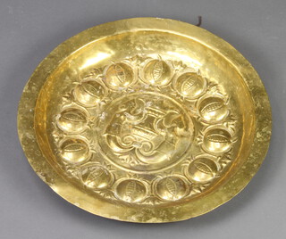 An embossed brass dish 45cm diam. 