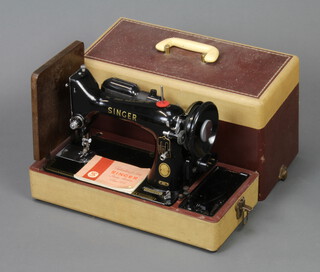 A Singer electric sewing machine no.EM702878 (no foot control)