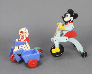 A child's RAR Toy product push along clown on a motorcycle and 1 other Minnie Mouse 
