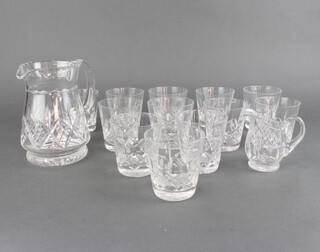 A cut glass water jug, 12 tumblers, a small jug 